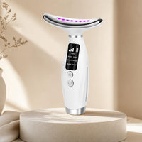 LUMÉA GLOW 7 LED beauty massager on ivory stone pedestal